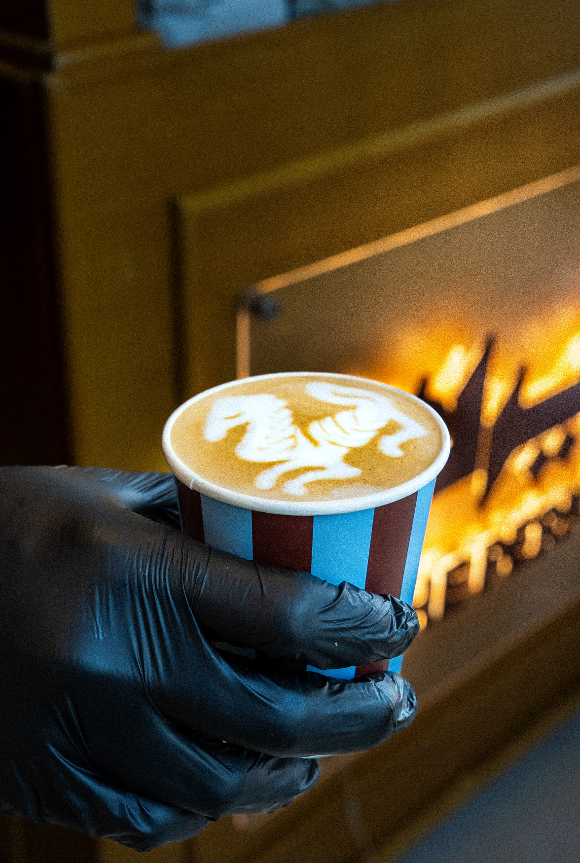 The Perk signature latte by the fireplace