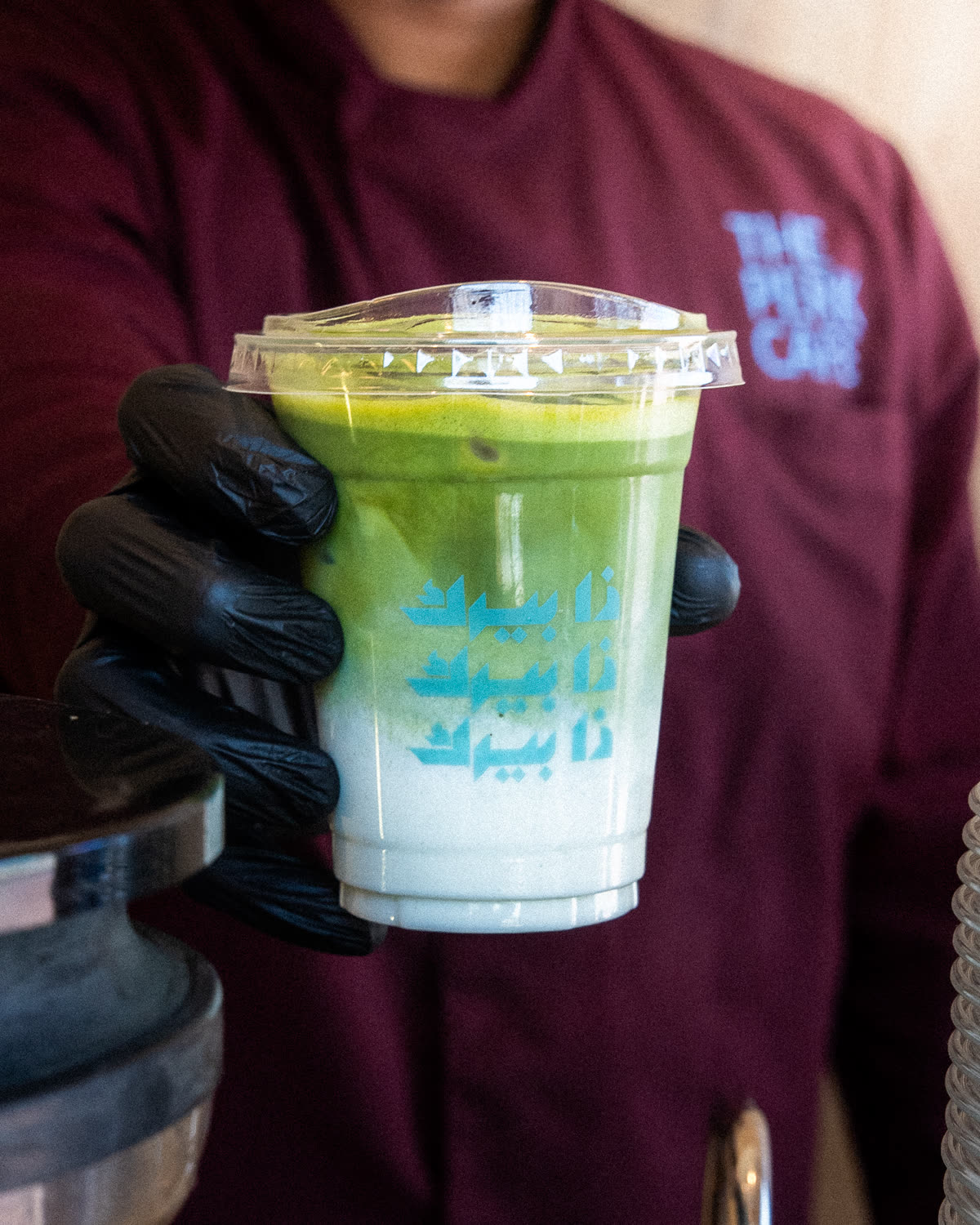 Iced matcha in a branded Perk cup