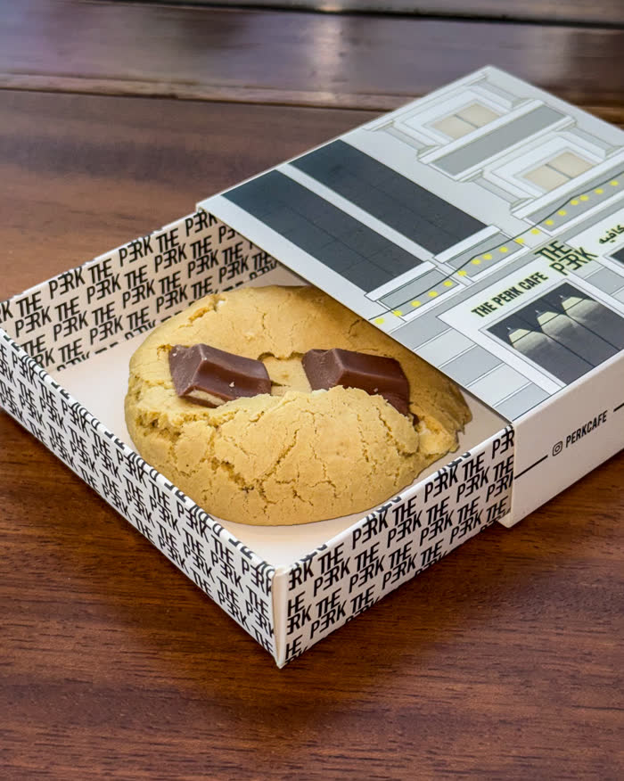 The Perk Cafe menu photography, cookie in branded box