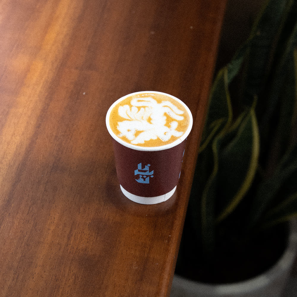 The Perk Cafe branded cup