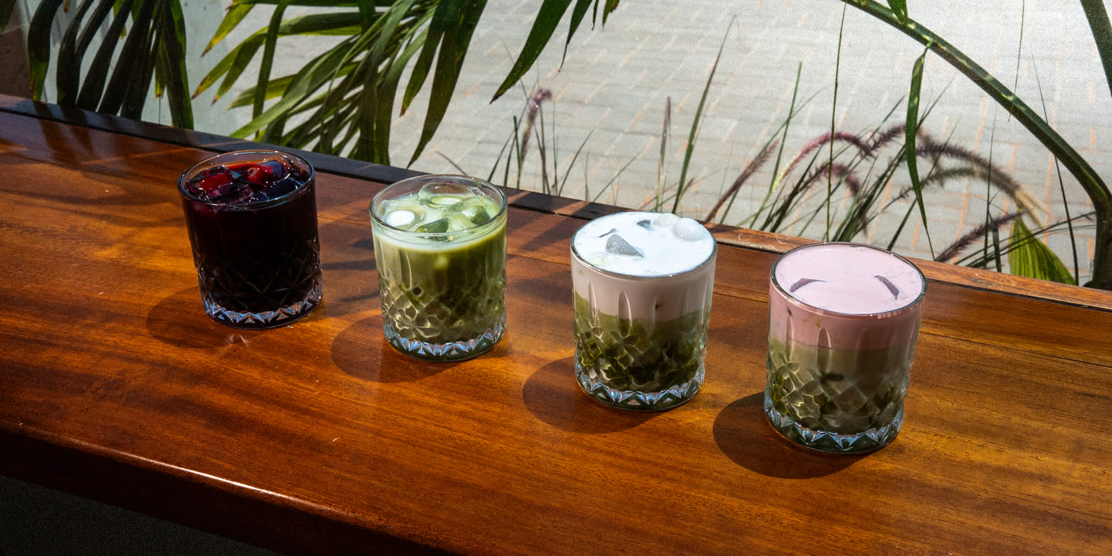 The Perk Cafe drinks spread, four drinks on the windowsill